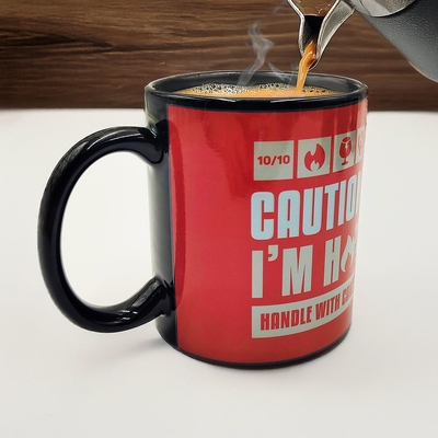 Product Κούπα Mad Monkey - Tasse "Caution I am Hot" - with color change base image